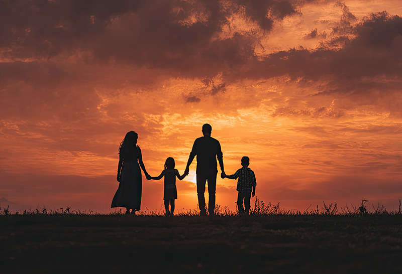silhouette family walking together outdoors